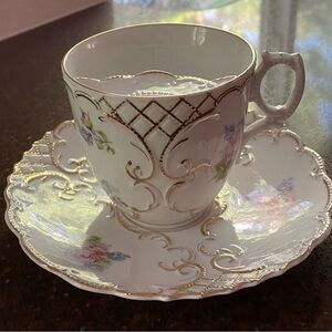 Vintage Elegant Porcelain Floral and Gold Accent Mustache Teacup and Saucer Set